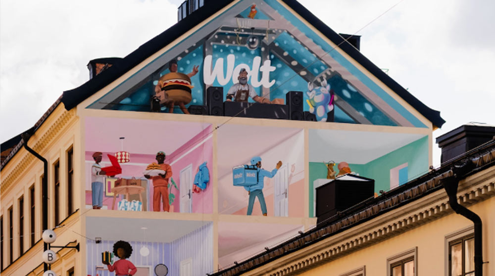 Wolt skrivet på ett hus